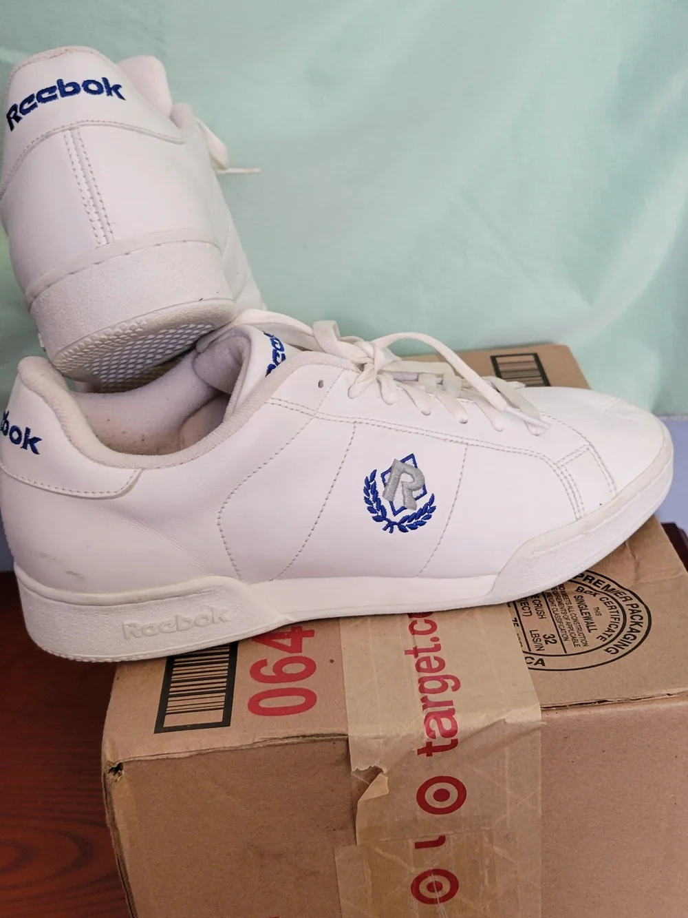Reebok Men’s Classic White Leather Sneakers with Blue Accents